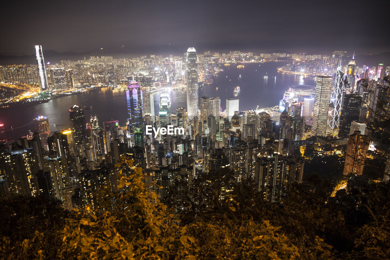 High angle view of city lit up at night