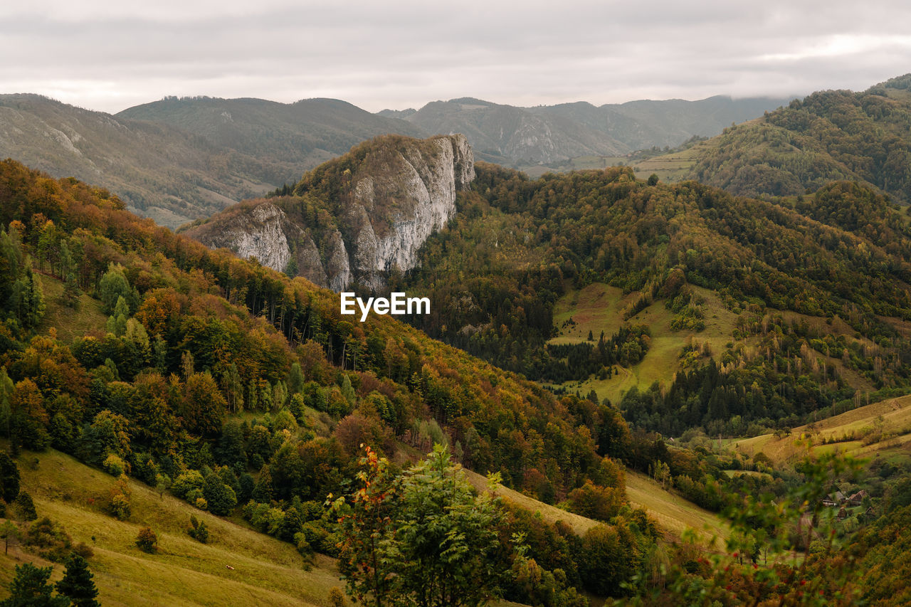 Scenic view of landscape and mountains against sky