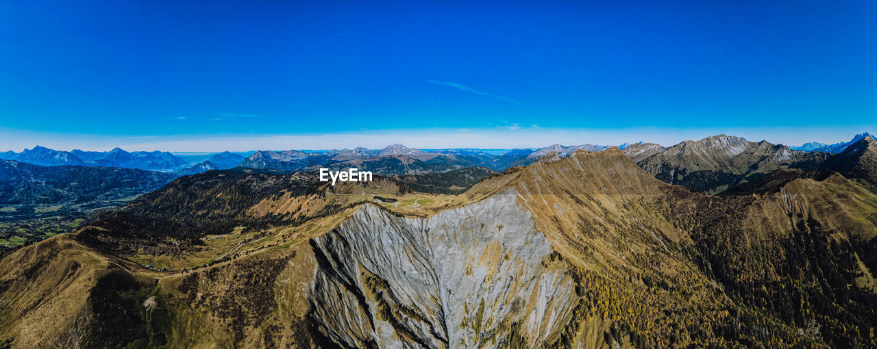 PANORAMIC VIEW OF LANDSCAPE AGAINST BLUE SKY