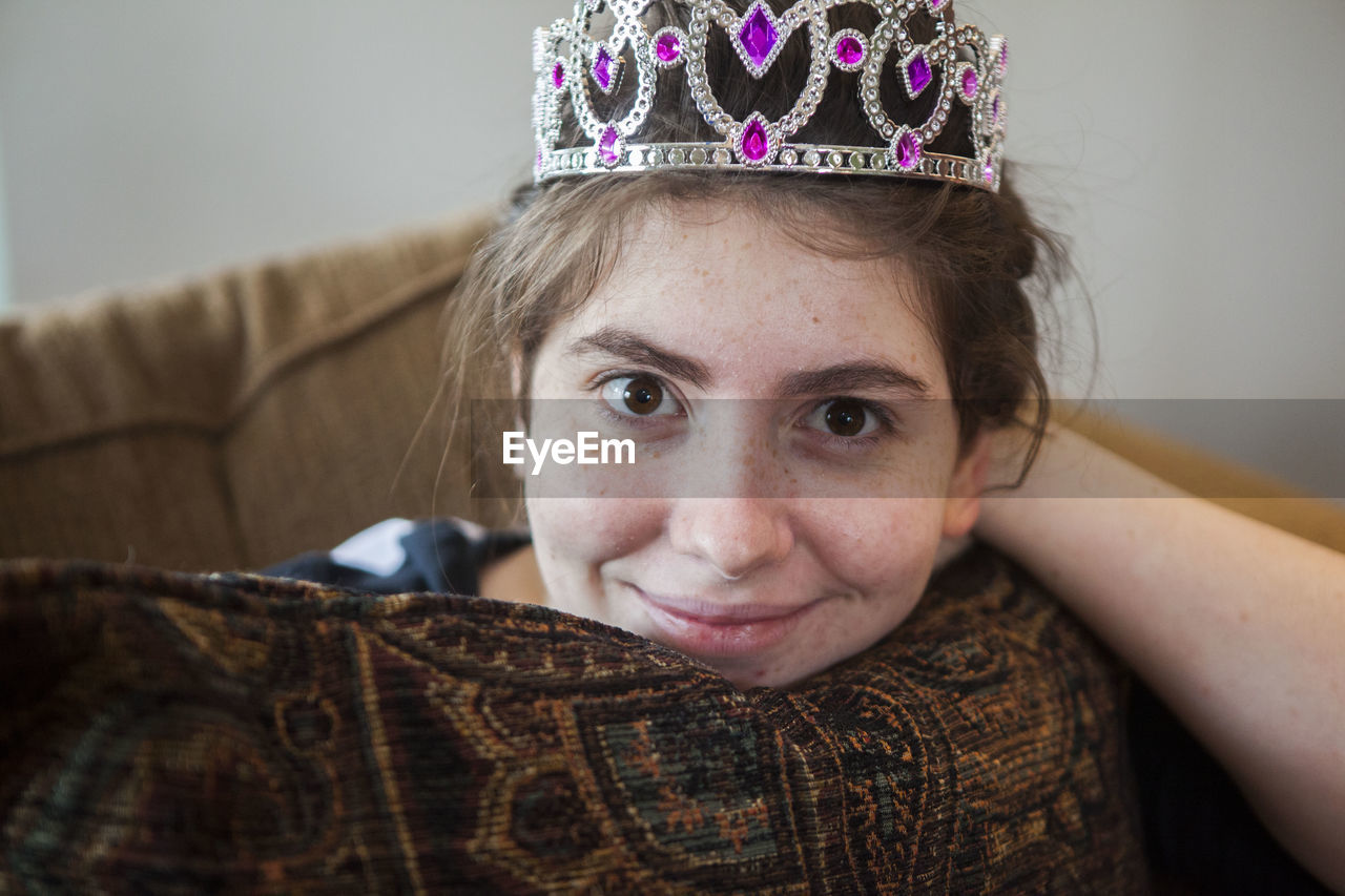 Portrait of smiling woman wearing crown