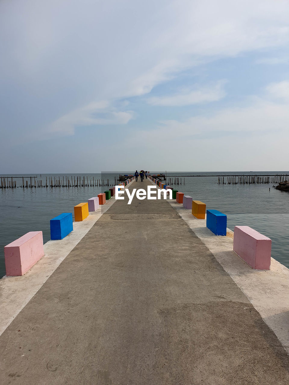 Pier over sea against sky