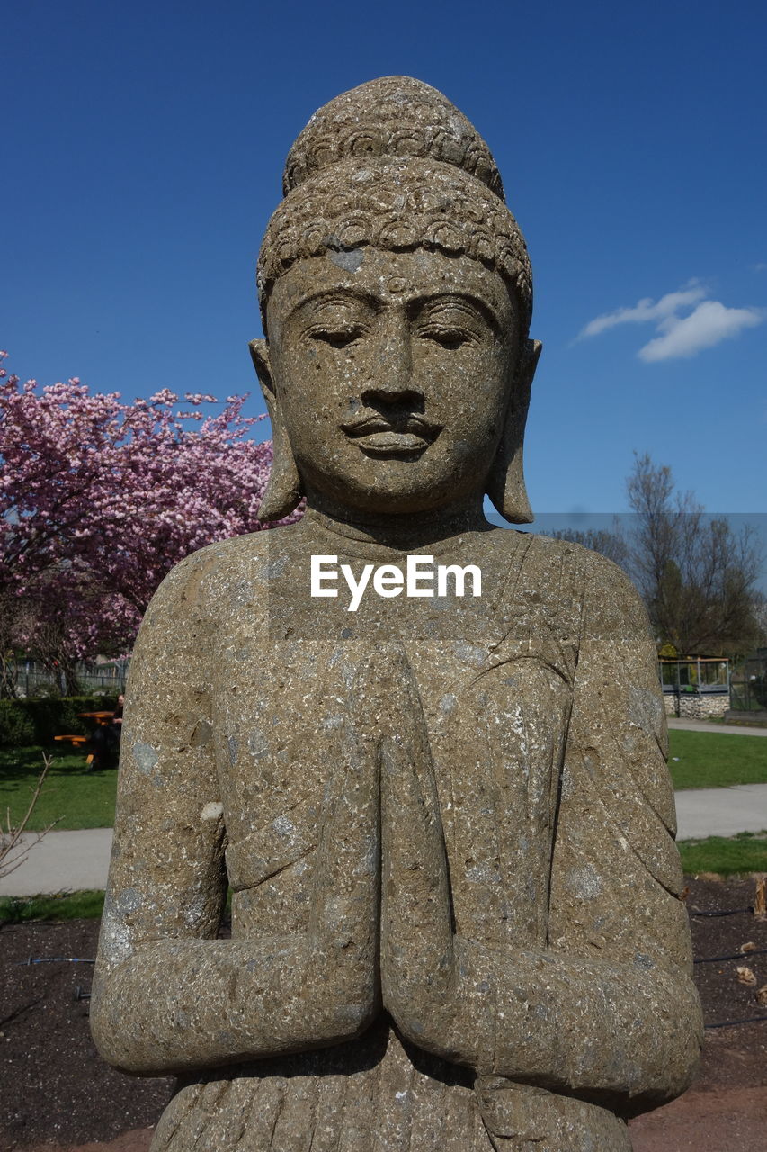 A statue of buddha, founder of the religion of buddhism