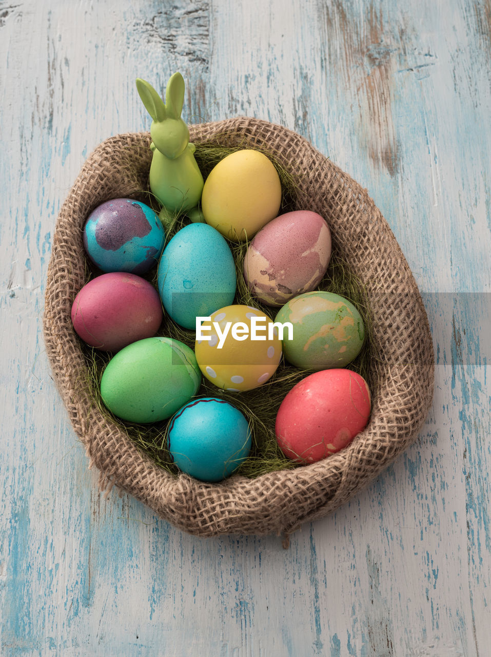 High angle view of easter eggs in sack on table