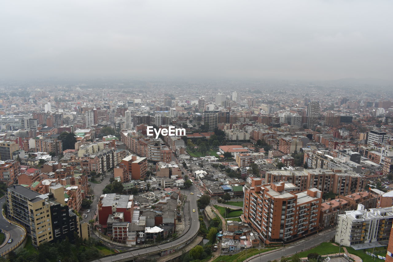 Aerial view of cityscape against sky