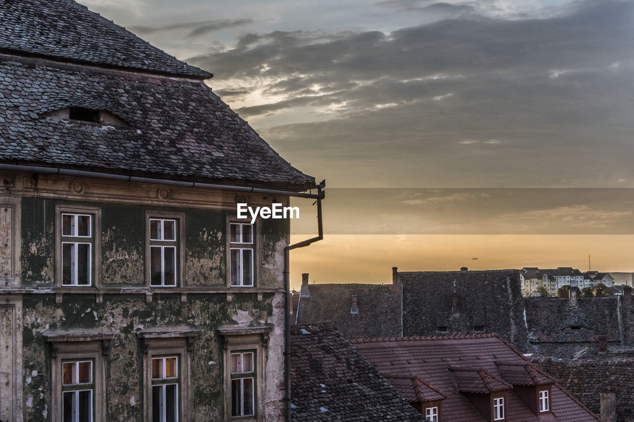 Exterior of old building in city against sky