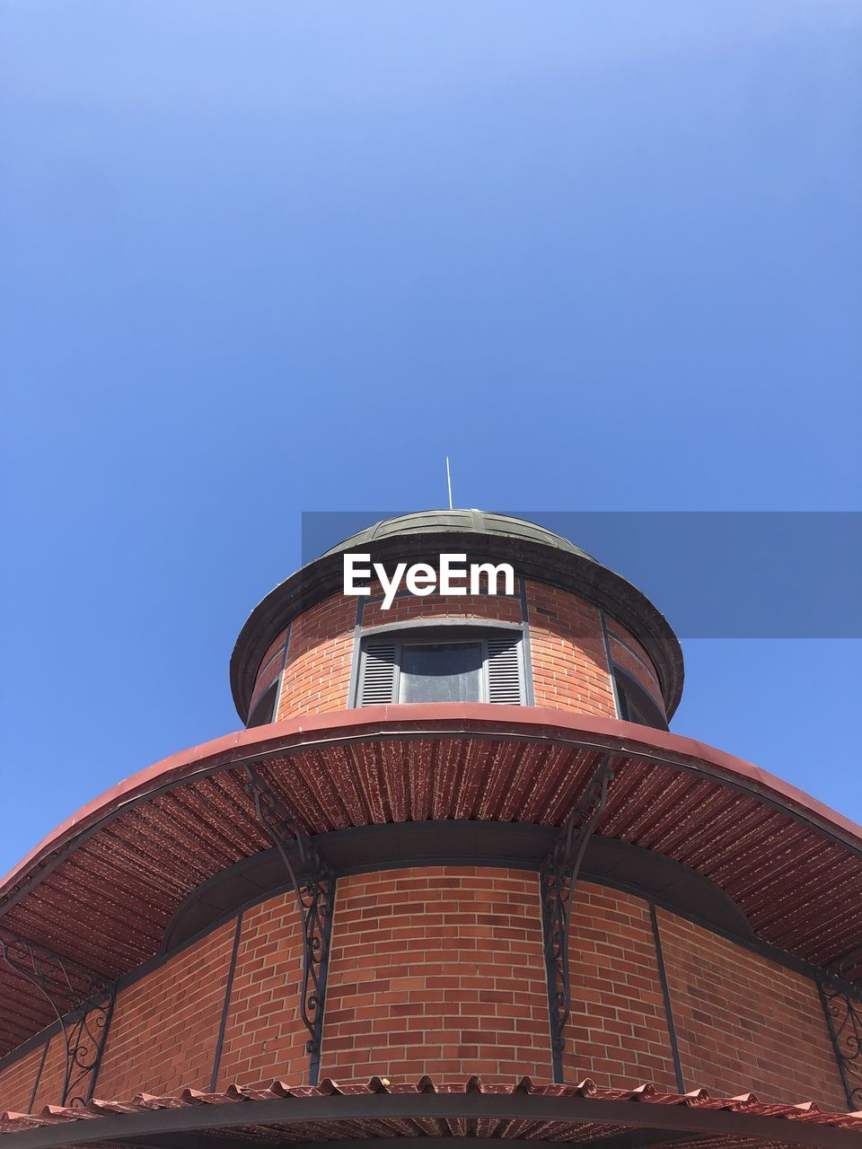 Low angle view of building against blue sky