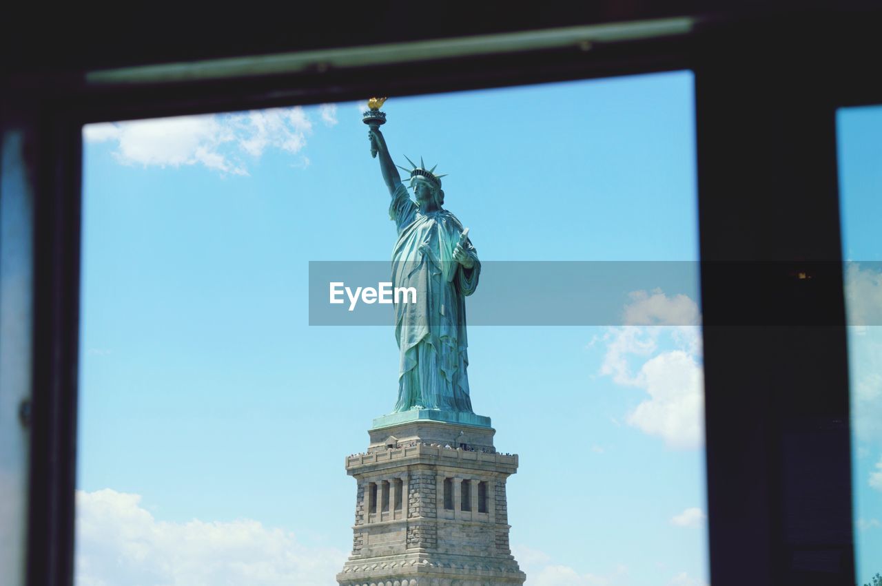 View of statue of liberty through window