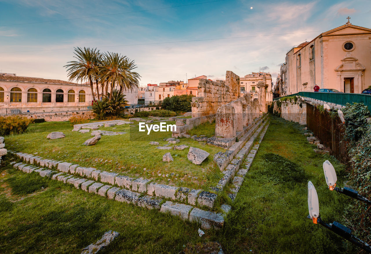 Temple of apollo in the centre of ortigia, syracuse at sunset