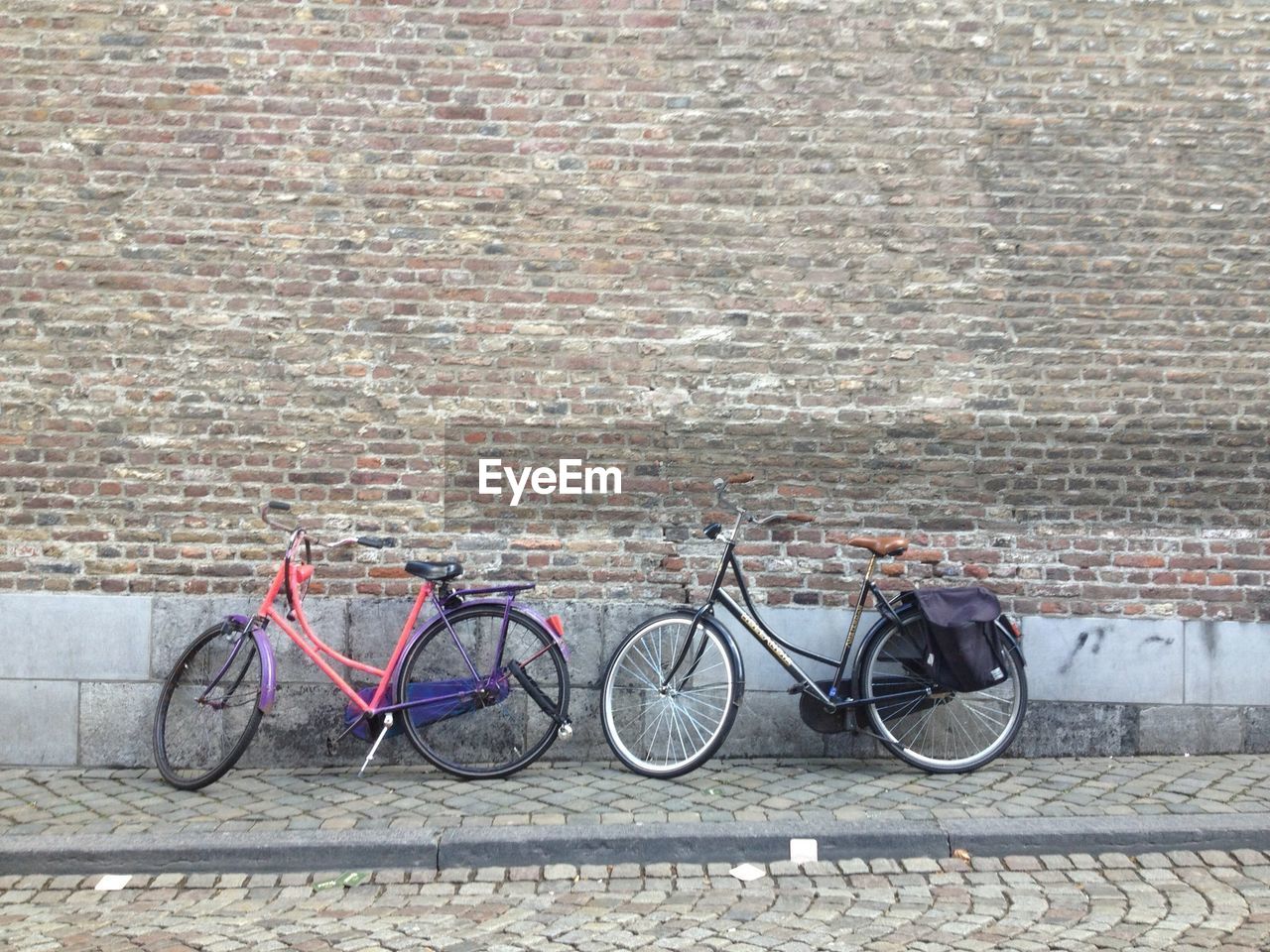 Front view image of two parked bicycles