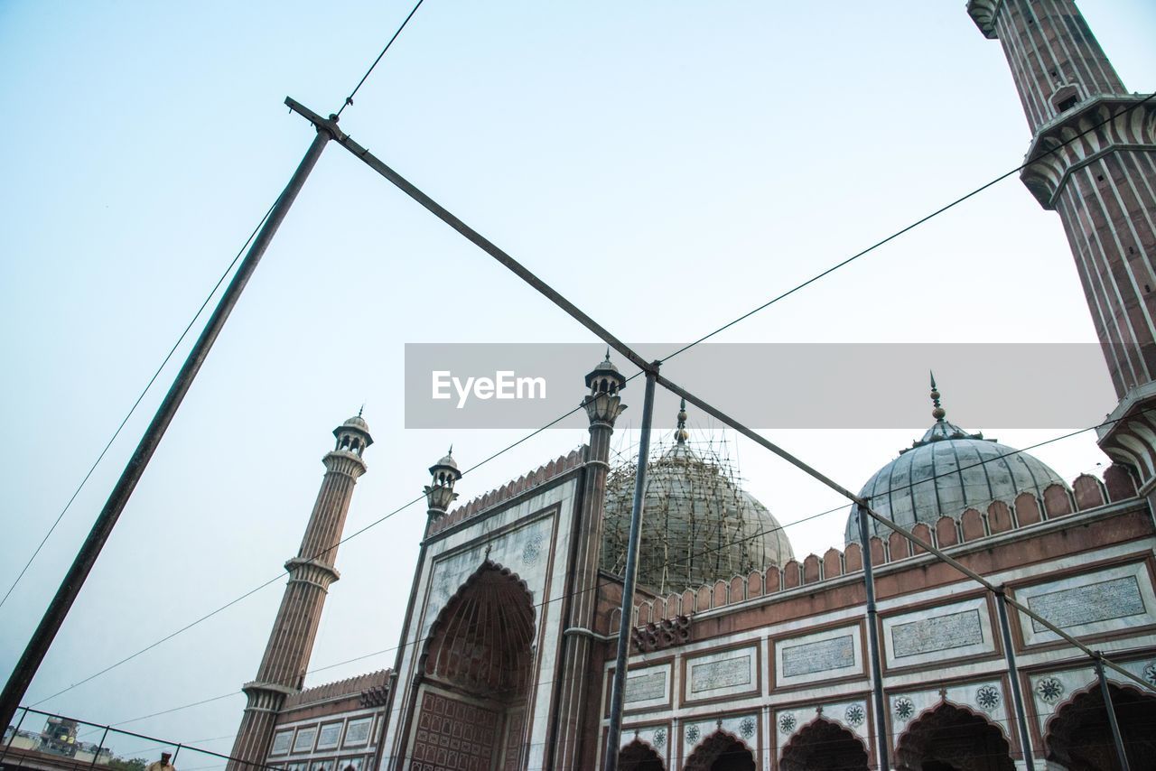 Low angle view of mosque against sky