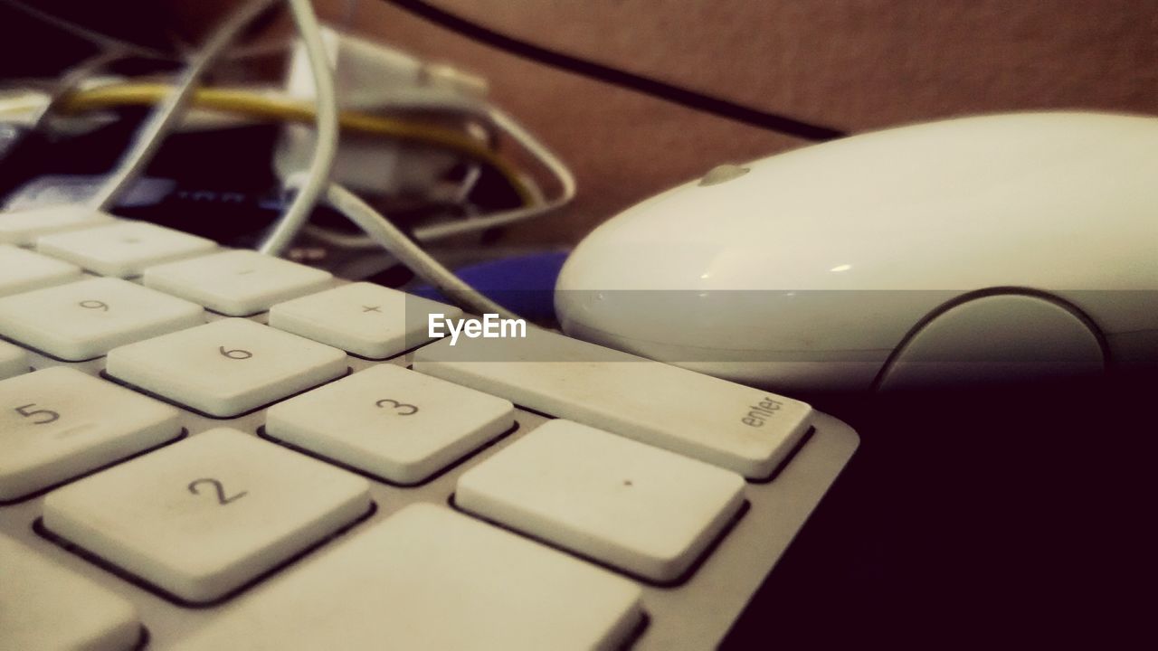 Close-up of mouse and keypad of laptop