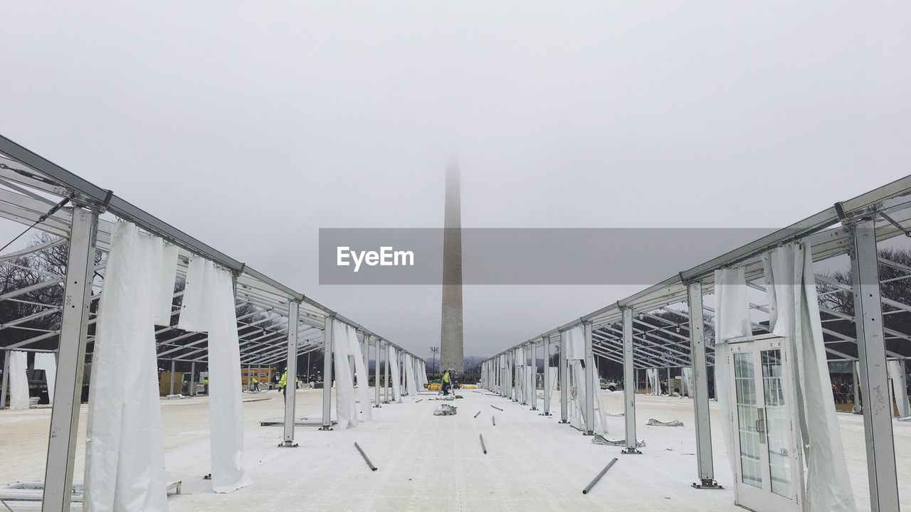 Monument against foggy sky