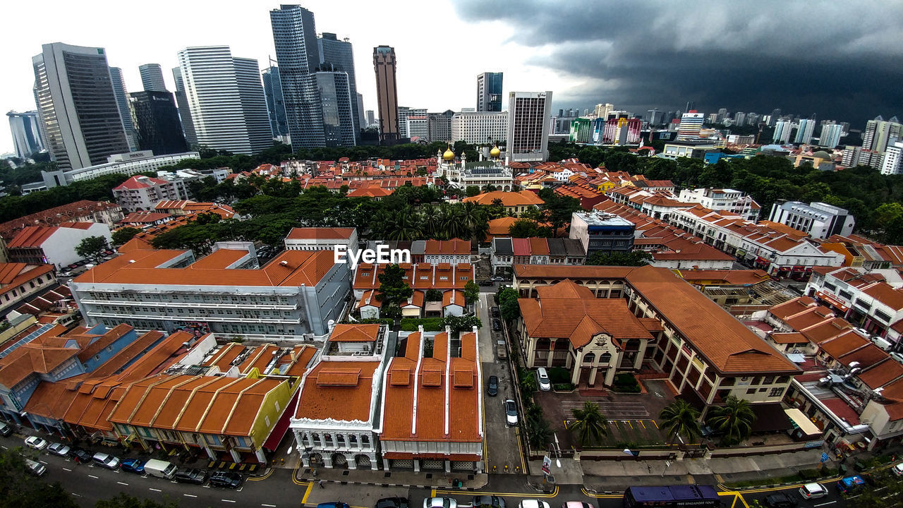 High angle view of buildings in city against sky