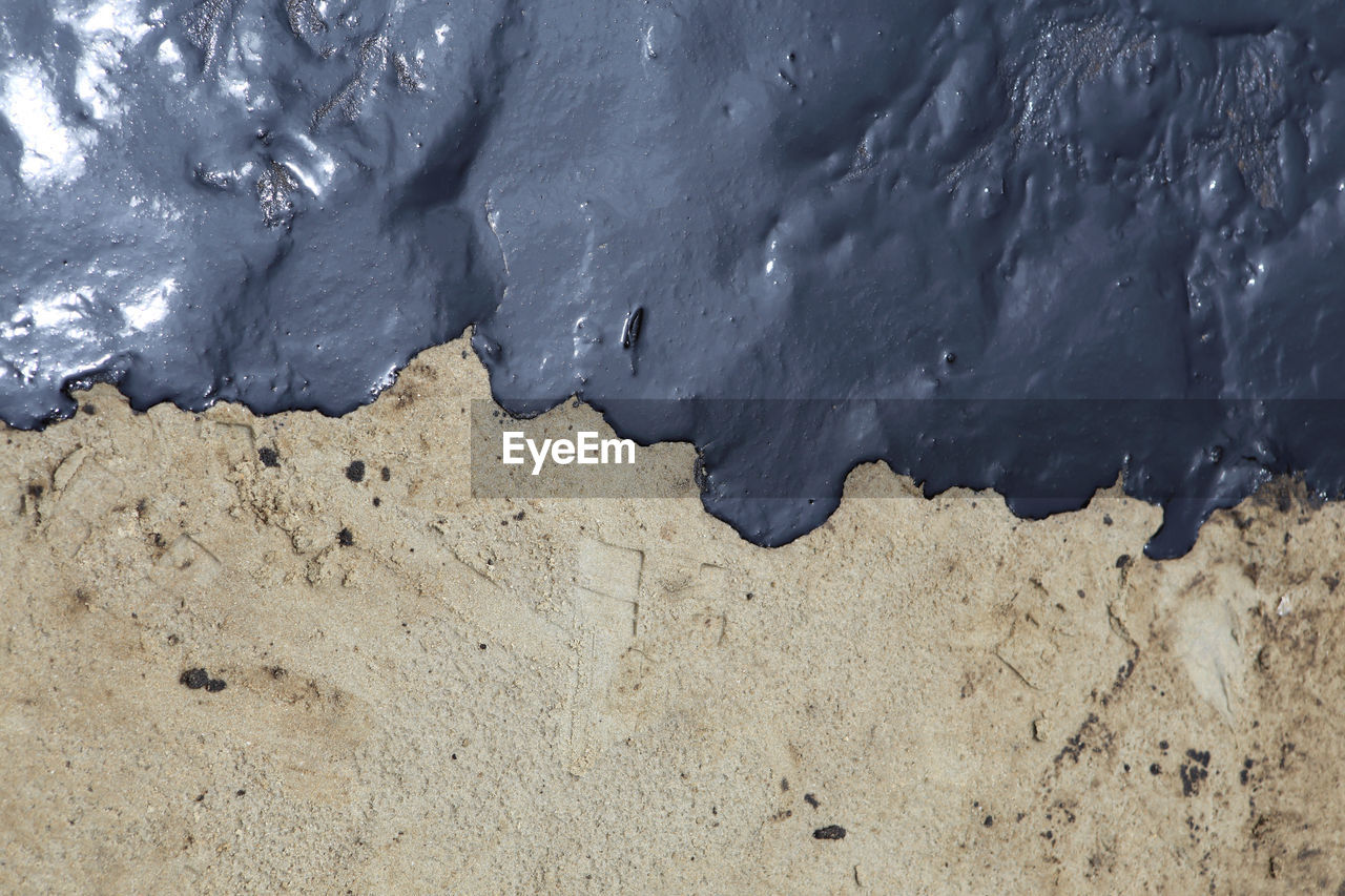 HIGH ANGLE VIEW OF SNOW ON BEACH