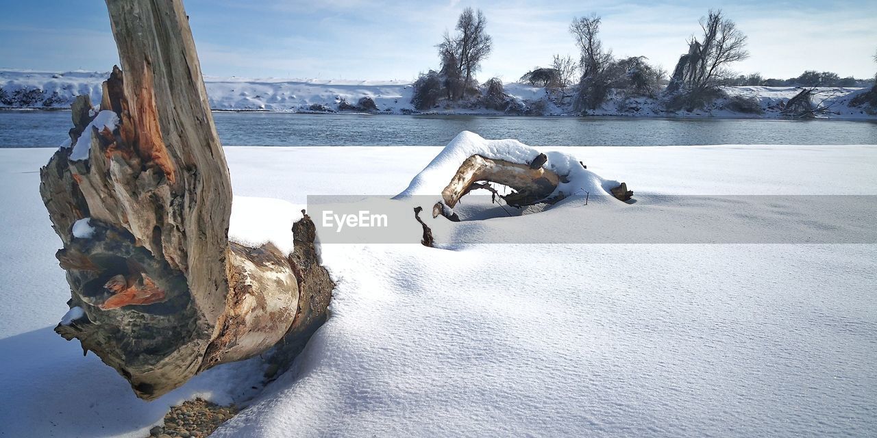 Scenic view of frozen lake against sky