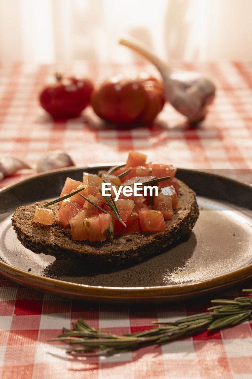 food and drink, food, fruit, dish, plate, breakfast, healthy eating, meal, produce, no people, sweet food, indoors, freshness, sweet, celebration, dessert, soft focus, tablecloth, table, baked, holiday, defocused, checked pattern, focus on foreground, meat