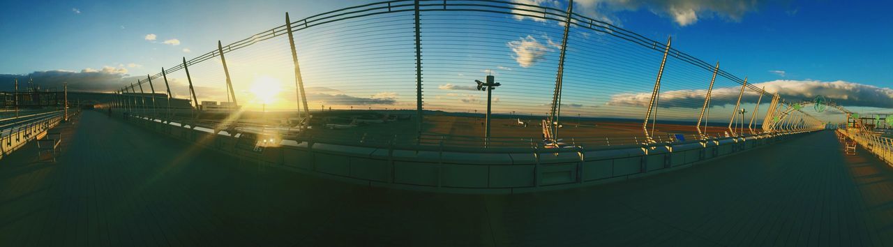 Panoramic view of airport against sky at sunrise