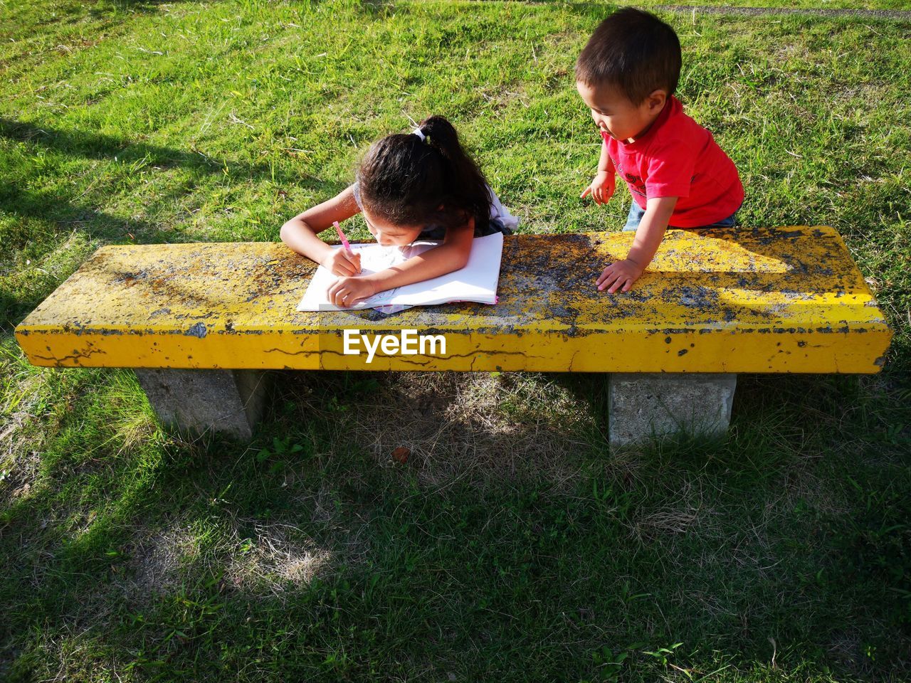 High angle view of kids drawing at park