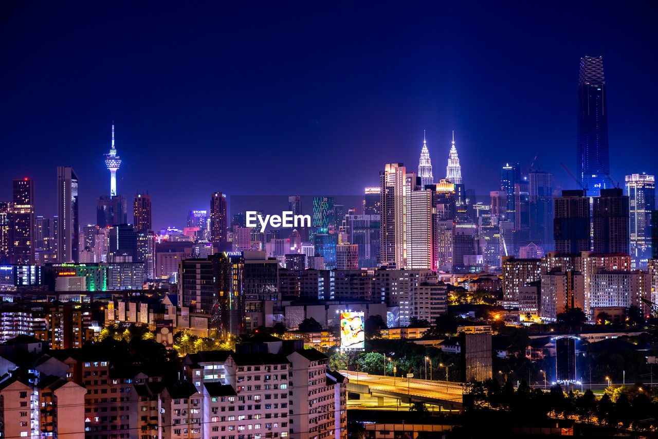 Illuminated buildings in city at night