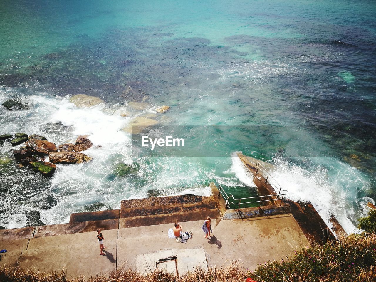 High angle view of people at beach against sky