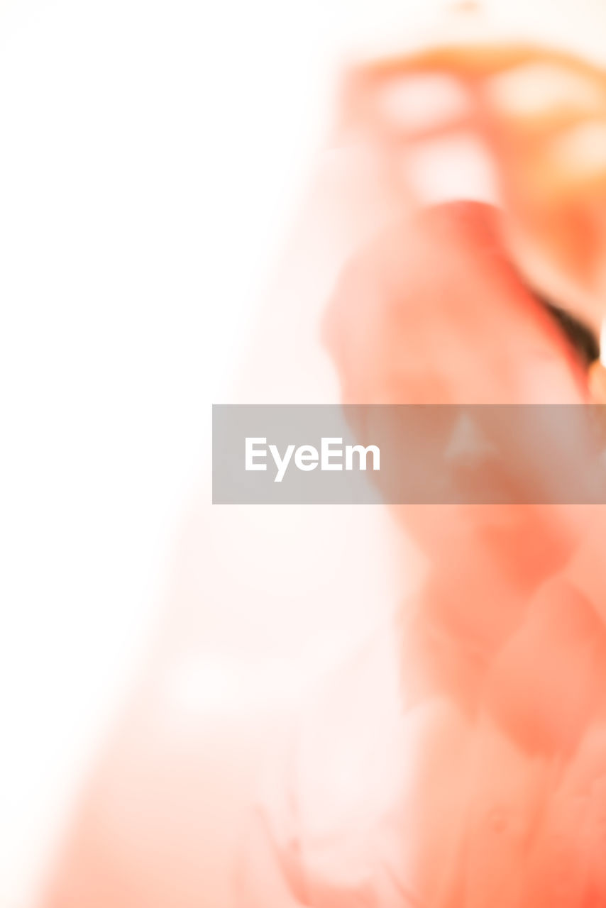 CLOSE-UP OF HAND ON WHITE BACKGROUND