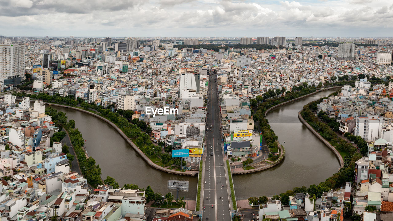 High angle view of crowd amidst buildings in city