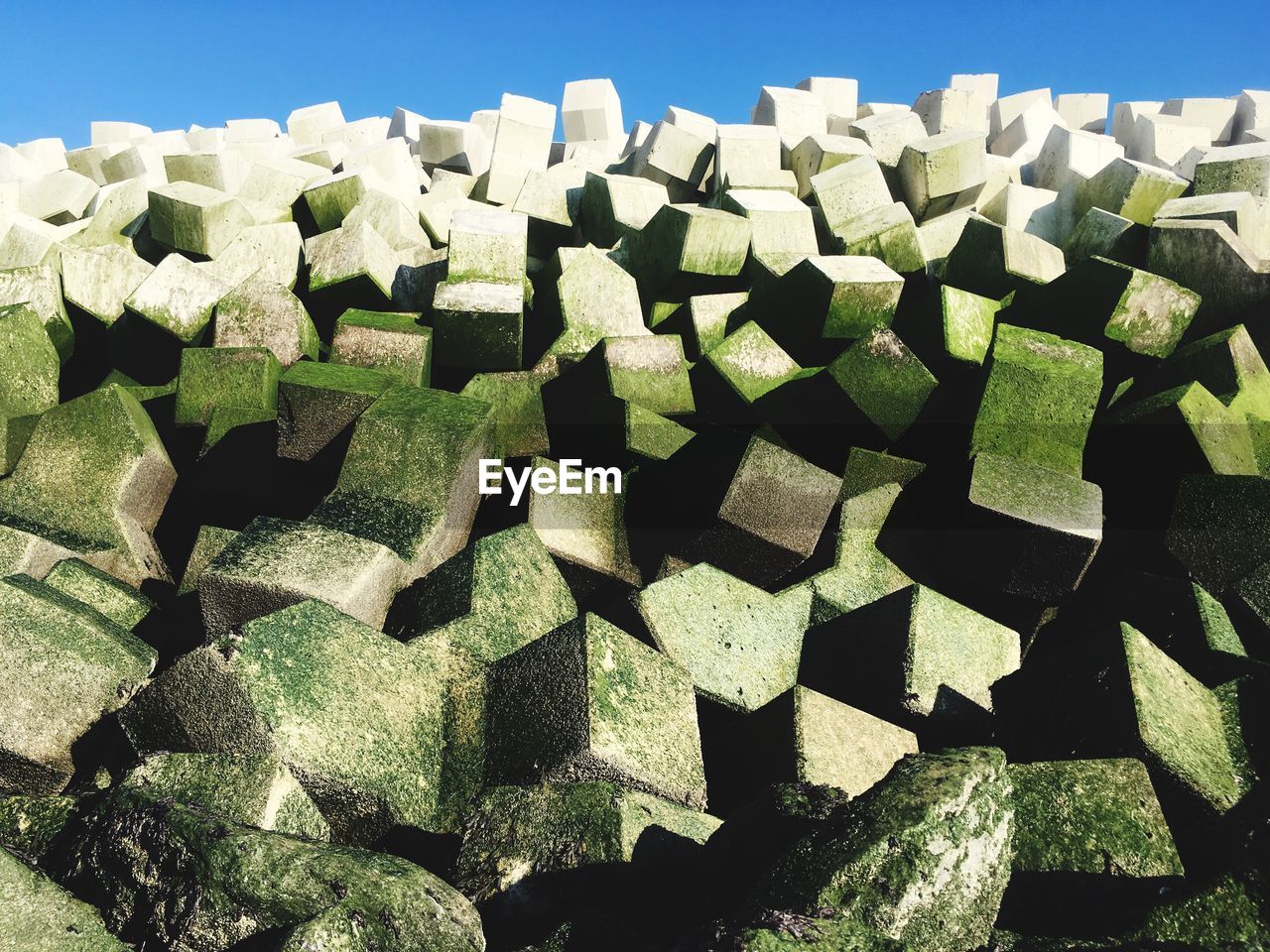 Close up of pile of stone blocks on sunny day