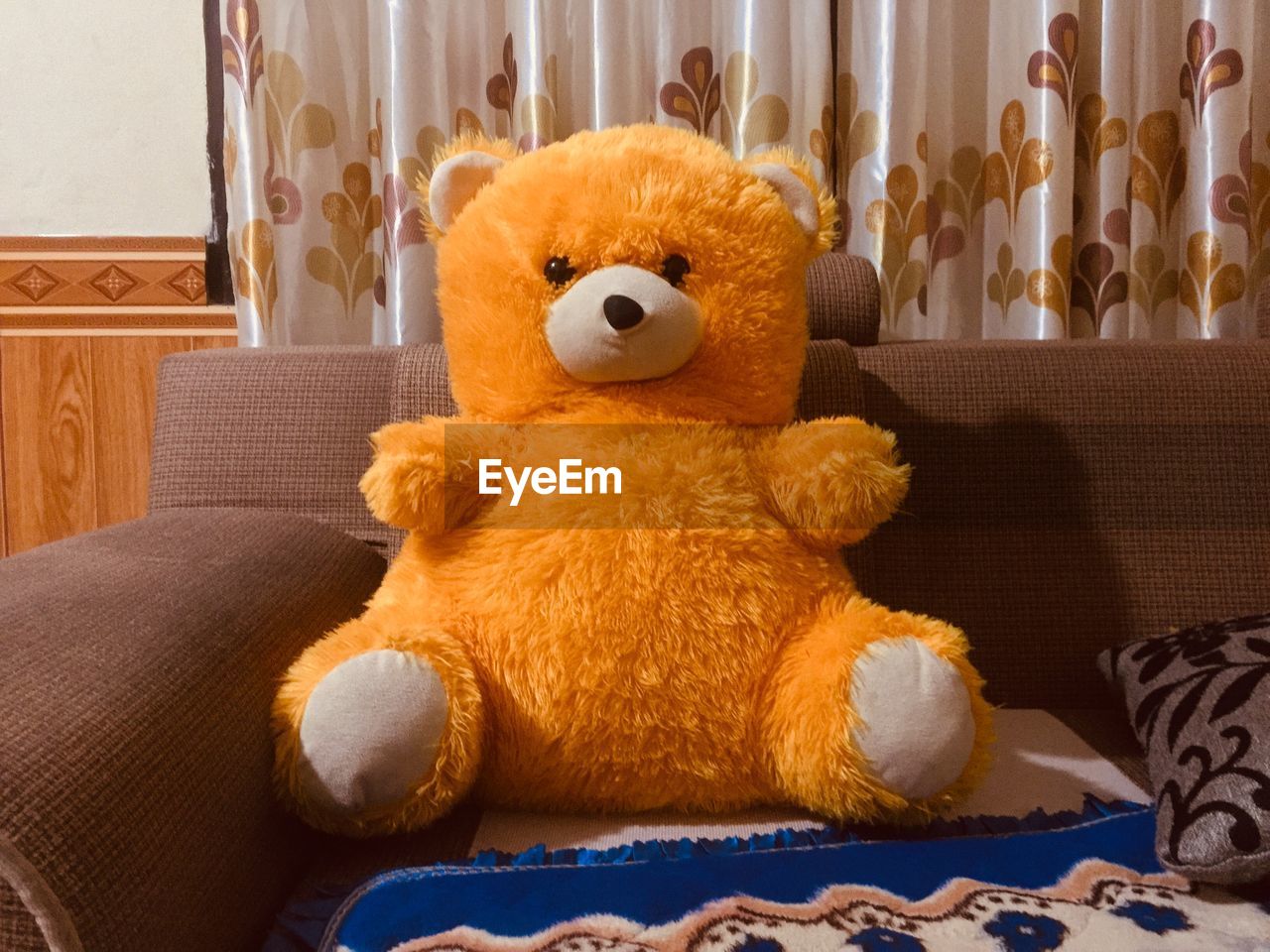 Stuffed toy on sofa at home