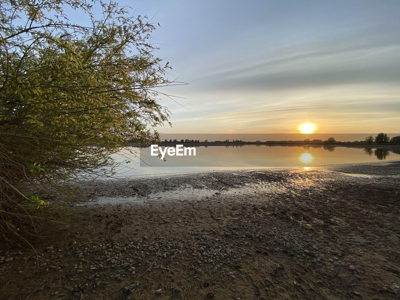 SCENIC VIEW OF BEACH DURING SUNSET