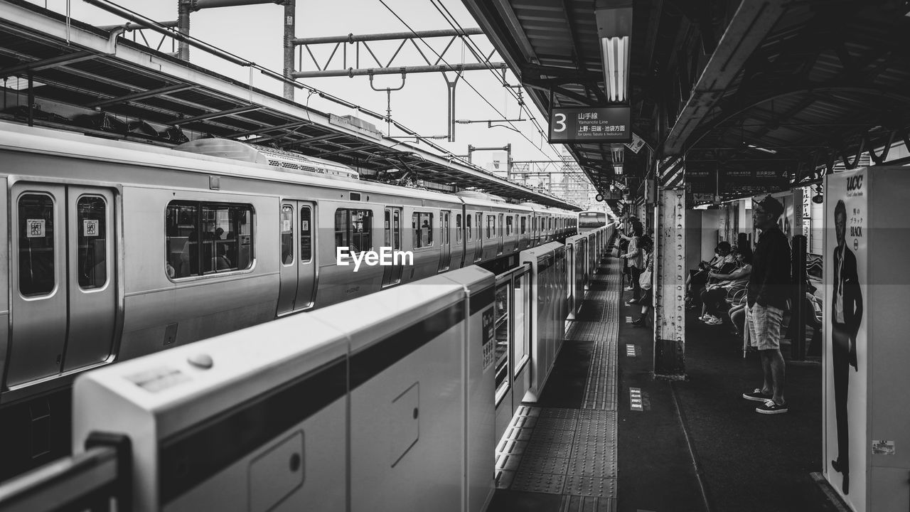 People waiting for train at station