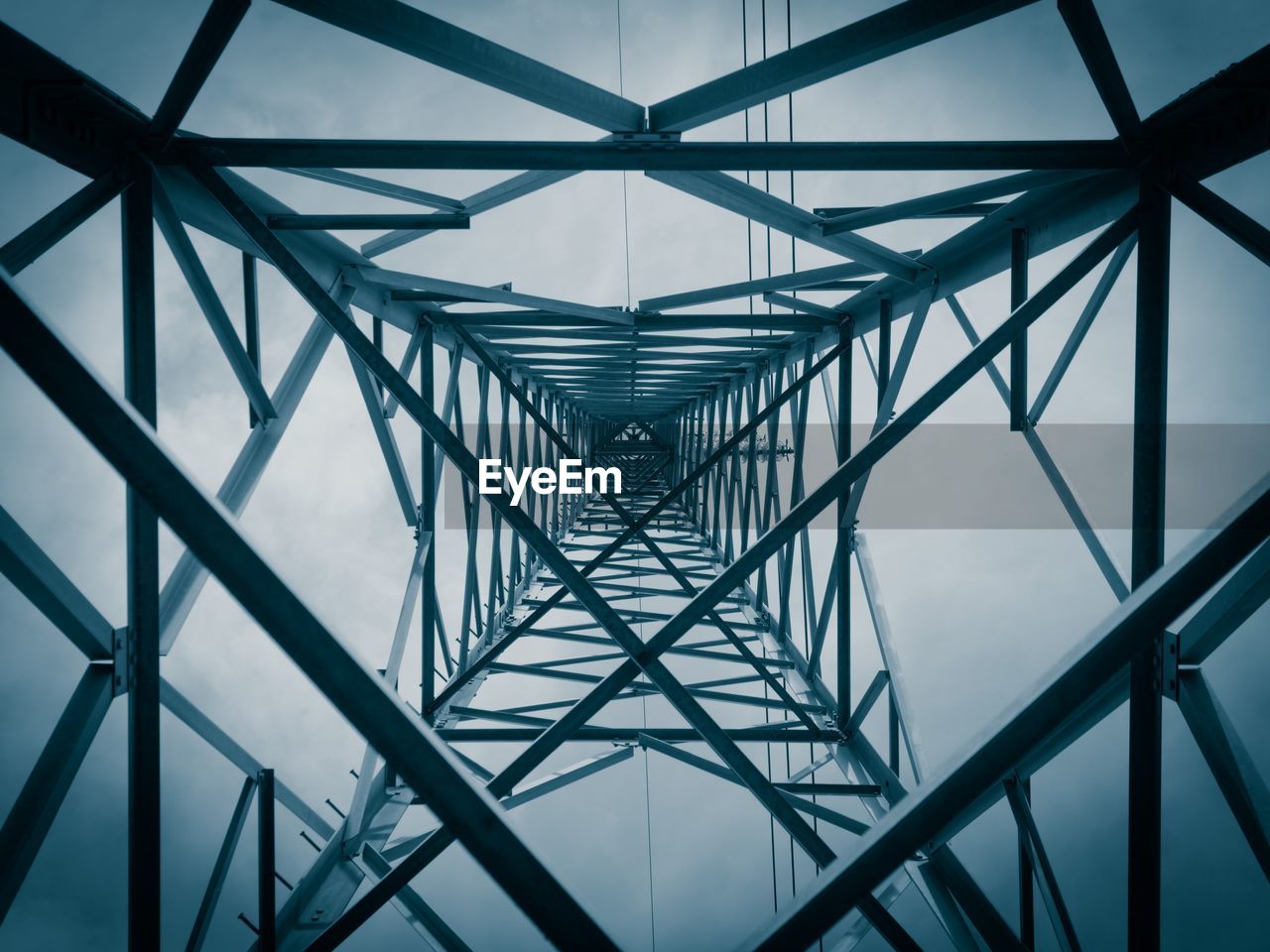 Full frame shot of electricity pylon against sky
