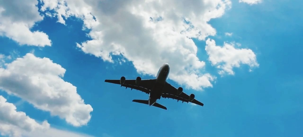 LOW ANGLE VIEW OF AIRPLANE AGAINST SKY