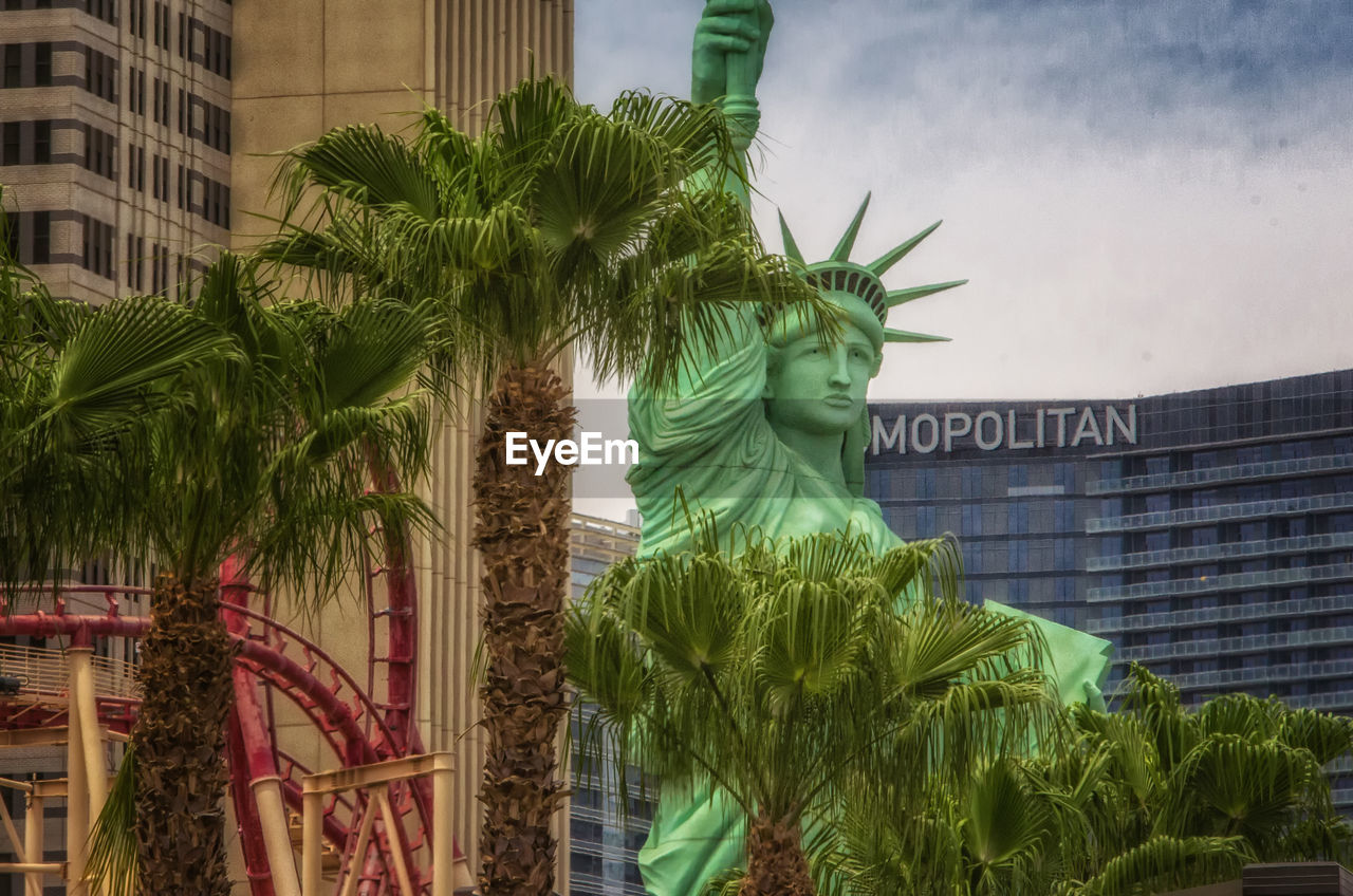 STATUE OF PALM TREES AGAINST SKY