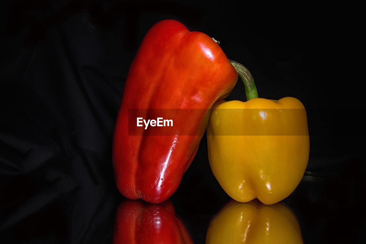 Close-up of bell peppers against black background