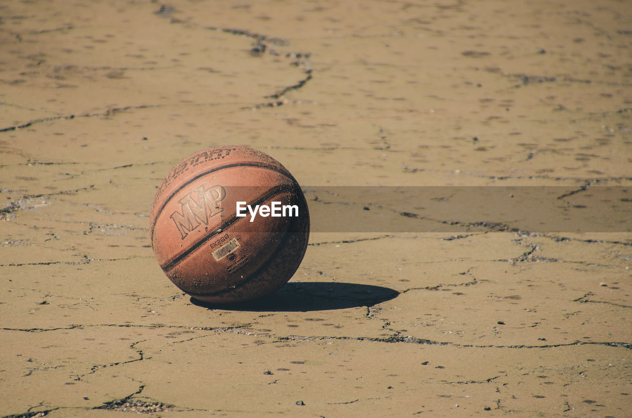 CLOSE-UP OF A BALL ON THE FLOOR