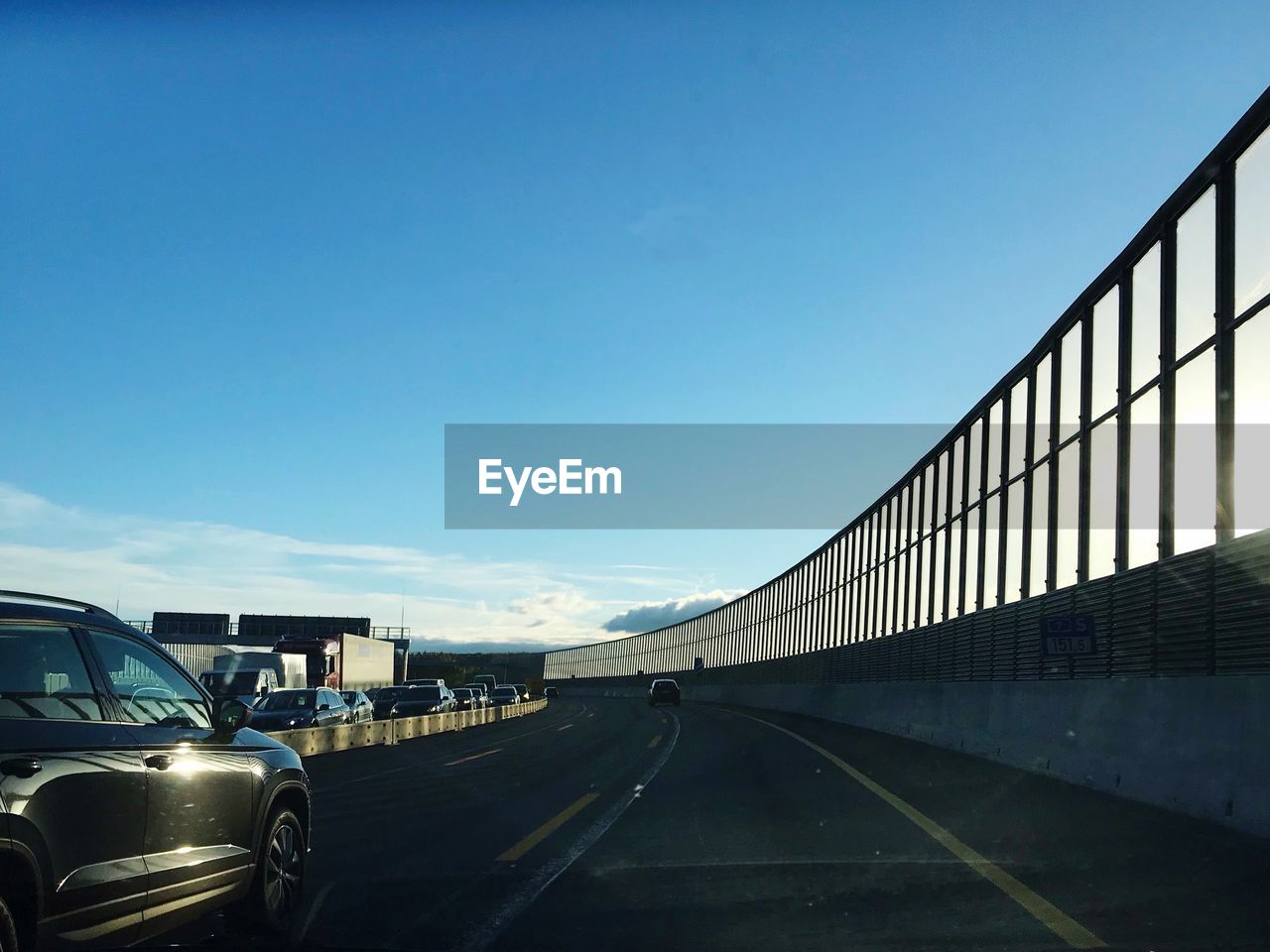 VIEW OF ROAD AGAINST BLUE SKY