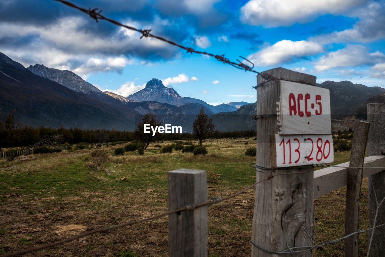 scenic view of mountains against cloudy sky