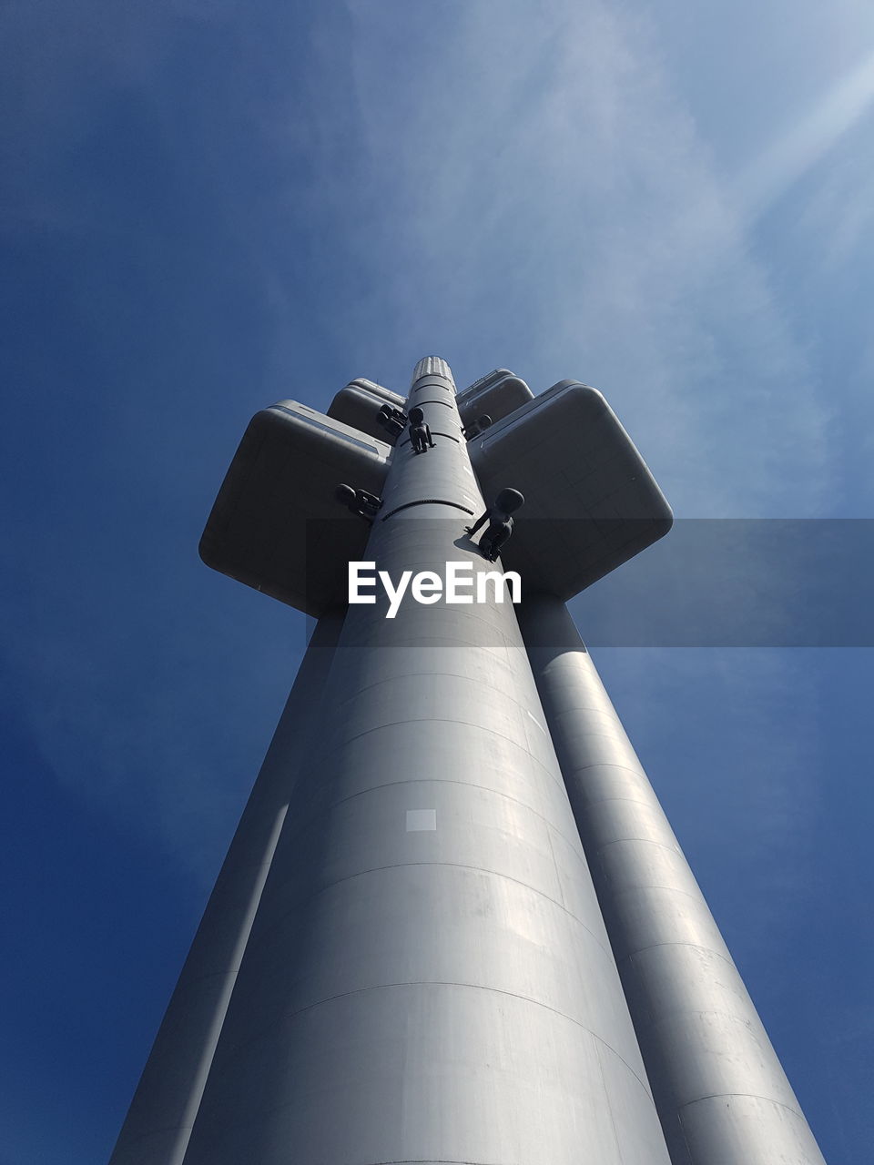 LOW ANGLE VIEW OF COMMUNICATIONS TOWER AGAINST SKY