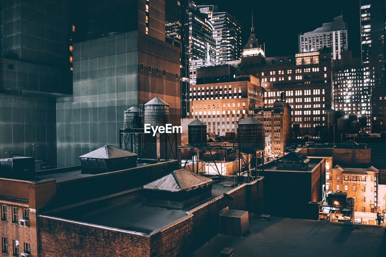 Low angle view of illuminated buildings at night