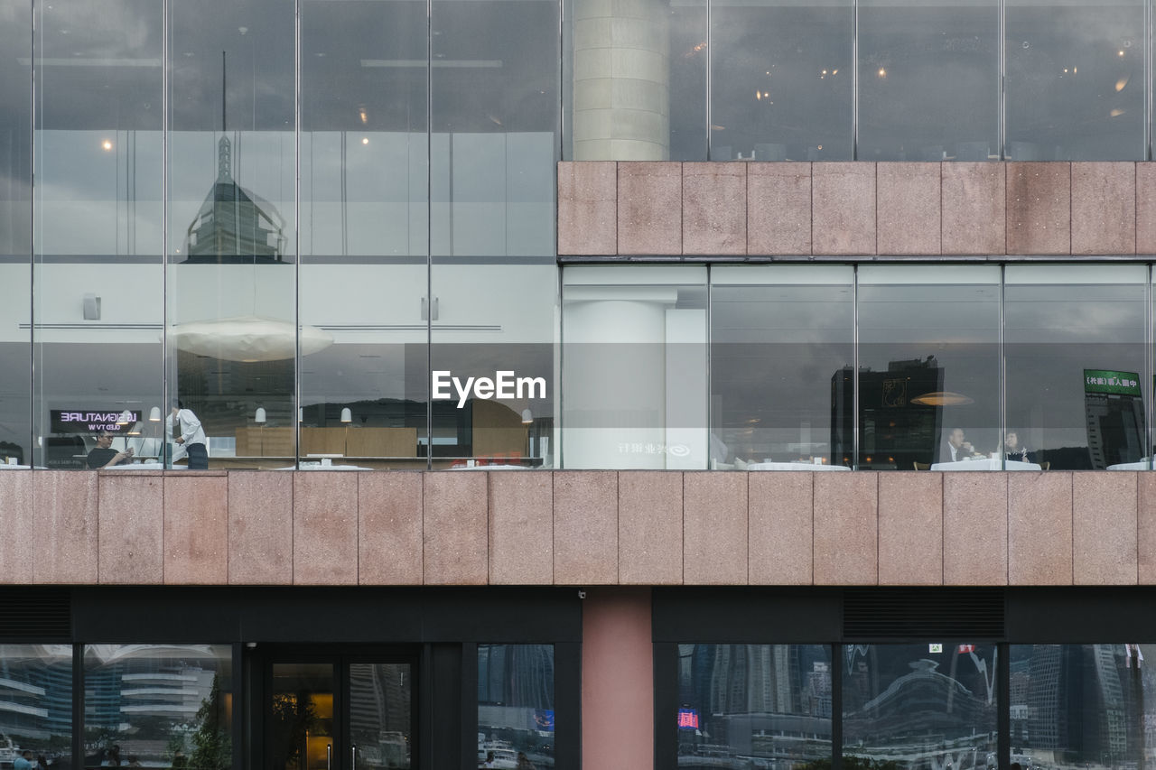 Reflection of building on glass window