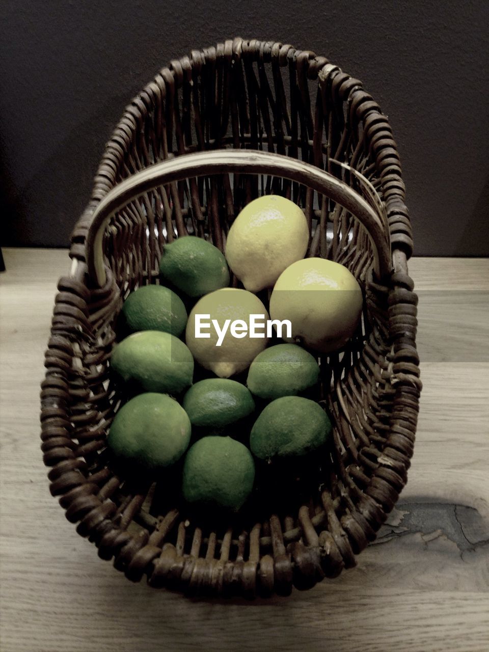 High angle view of limes in basket