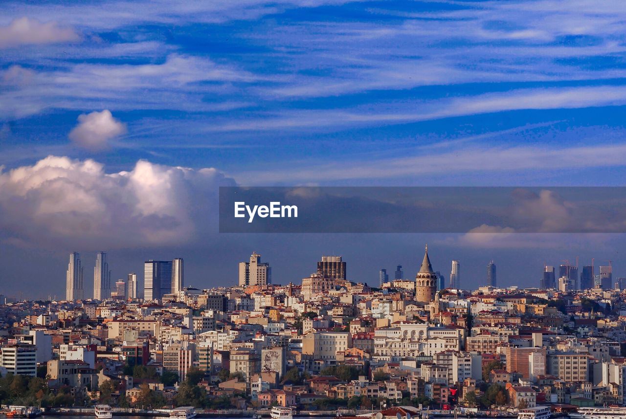 Modern buildings in city against sky