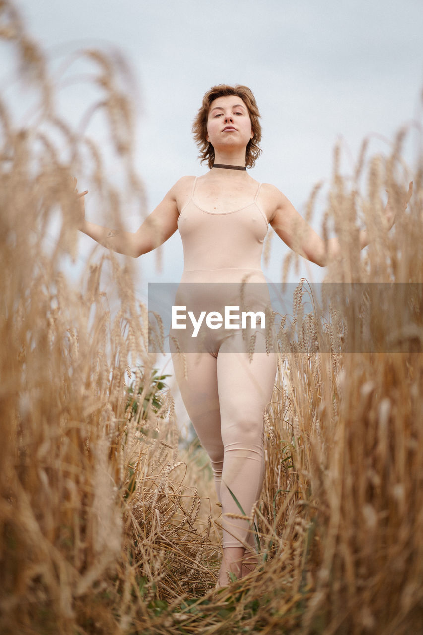 Woman standing on field