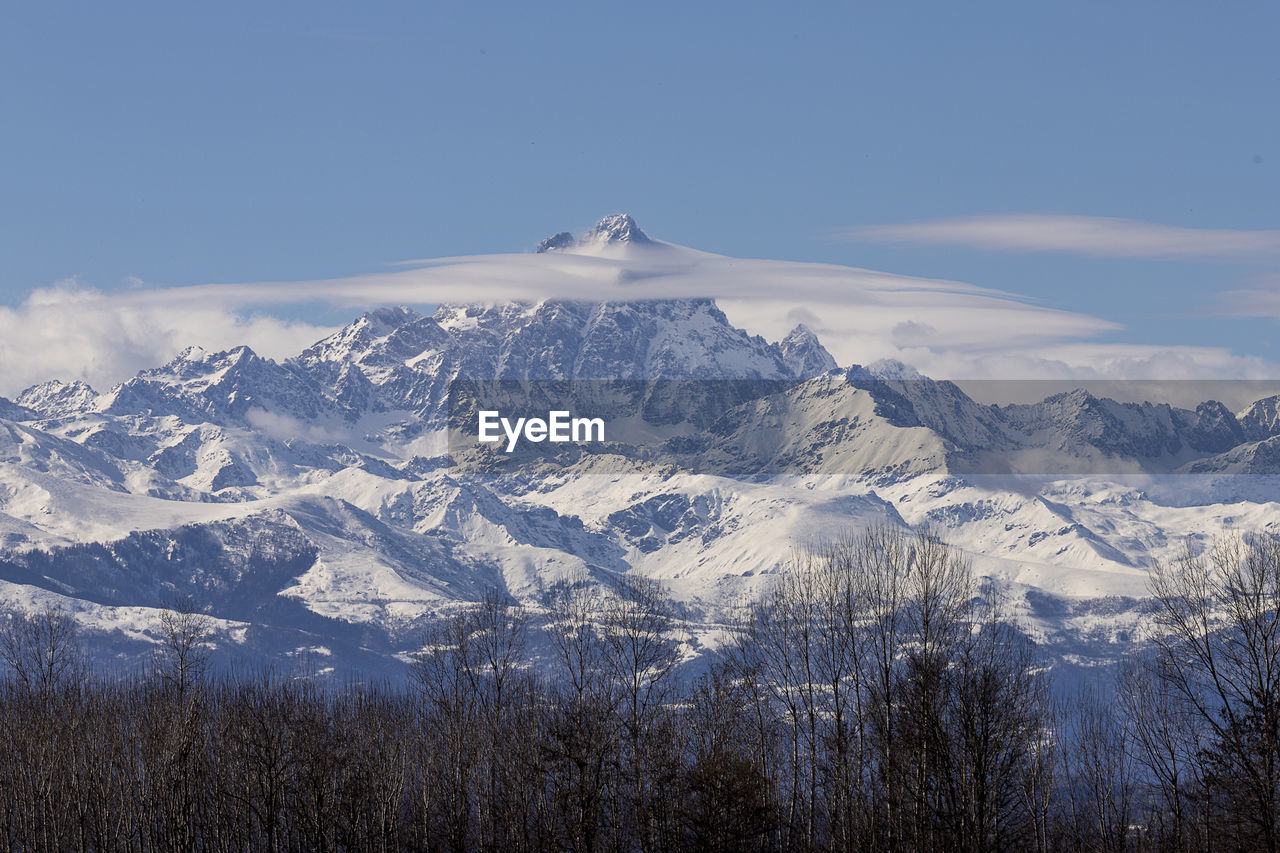 Scenic view of snowcapped mountains against sky