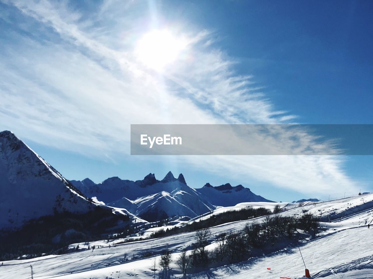 Scenic view of snowcapped mountains against sky