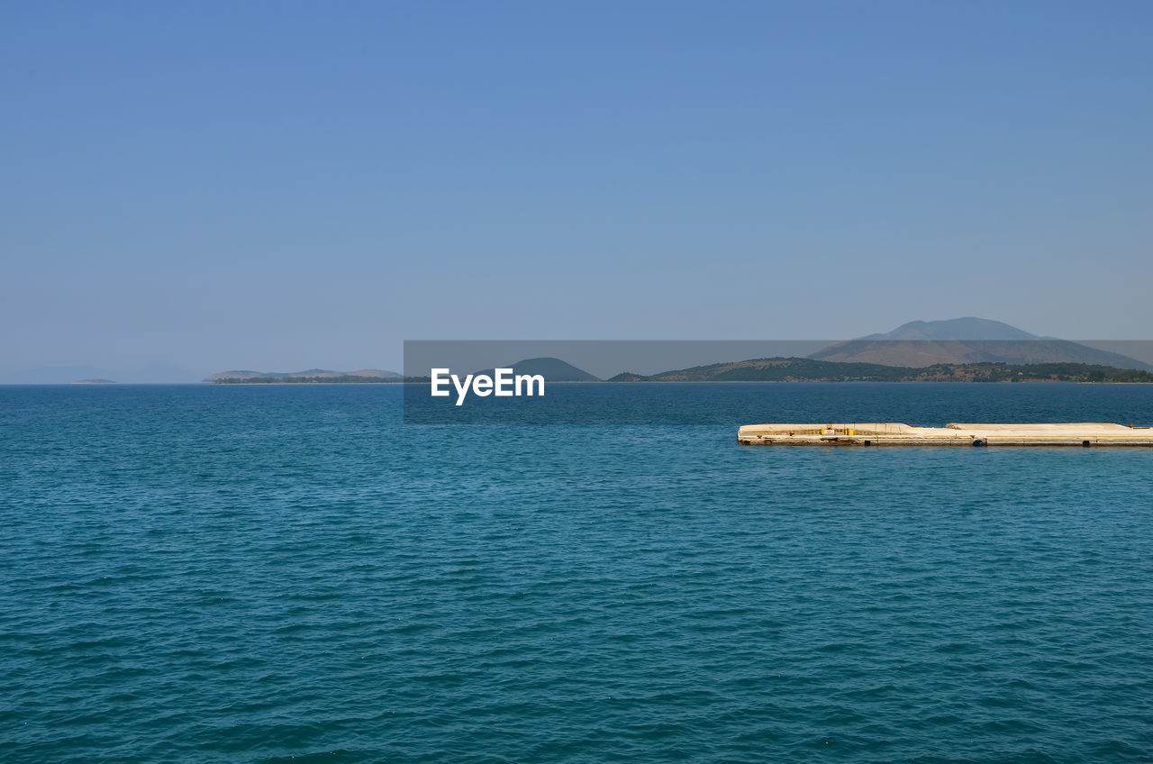 SCENIC VIEW OF SEA AGAINST BLUE SKY