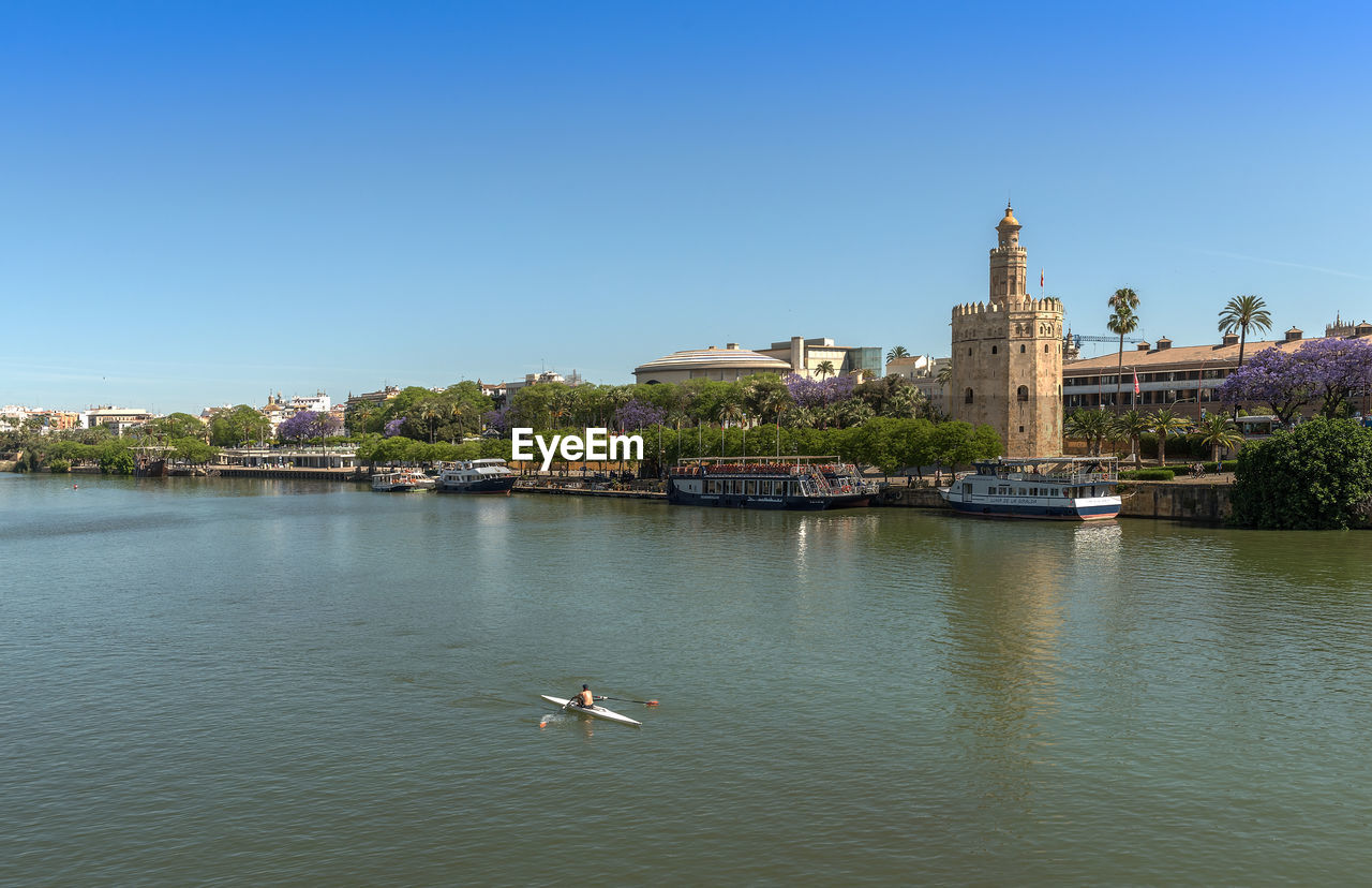 View of the guadalquivir river and the torre del oro, seville, spain