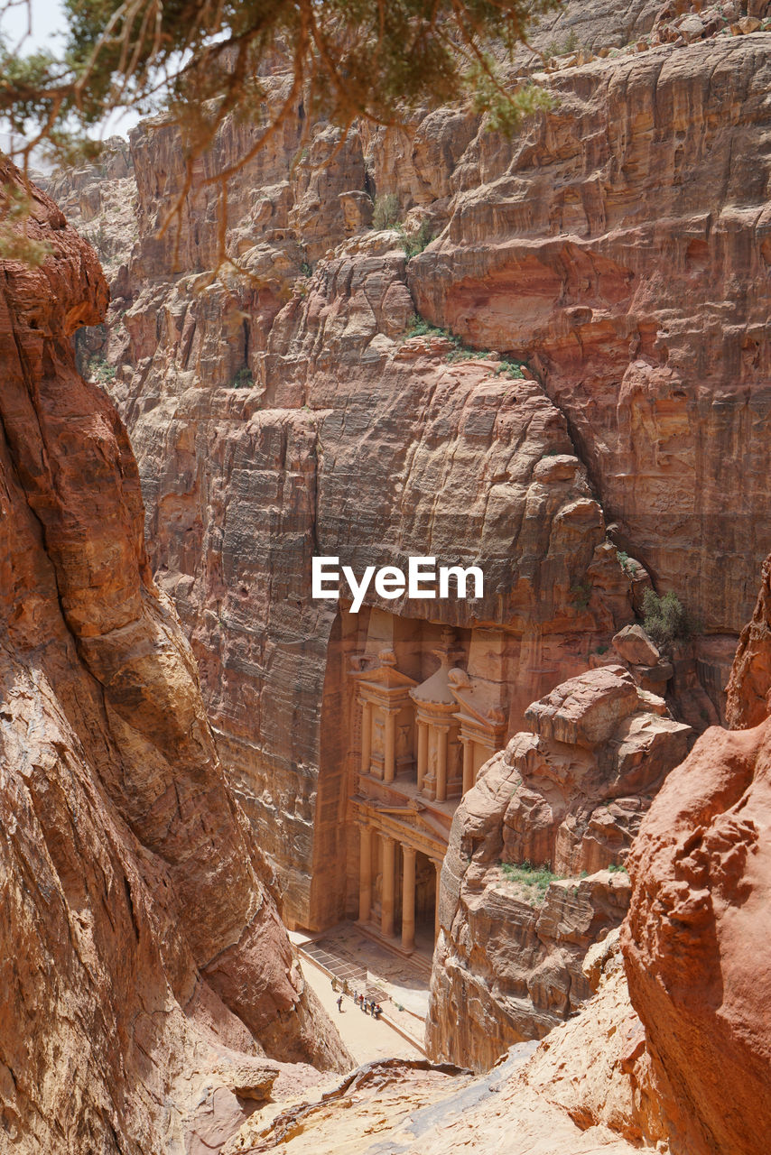 Low angle view of rock formations and ancient ruins