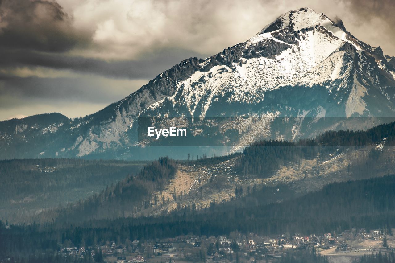 Scenic view of snowcapped mountains against sky