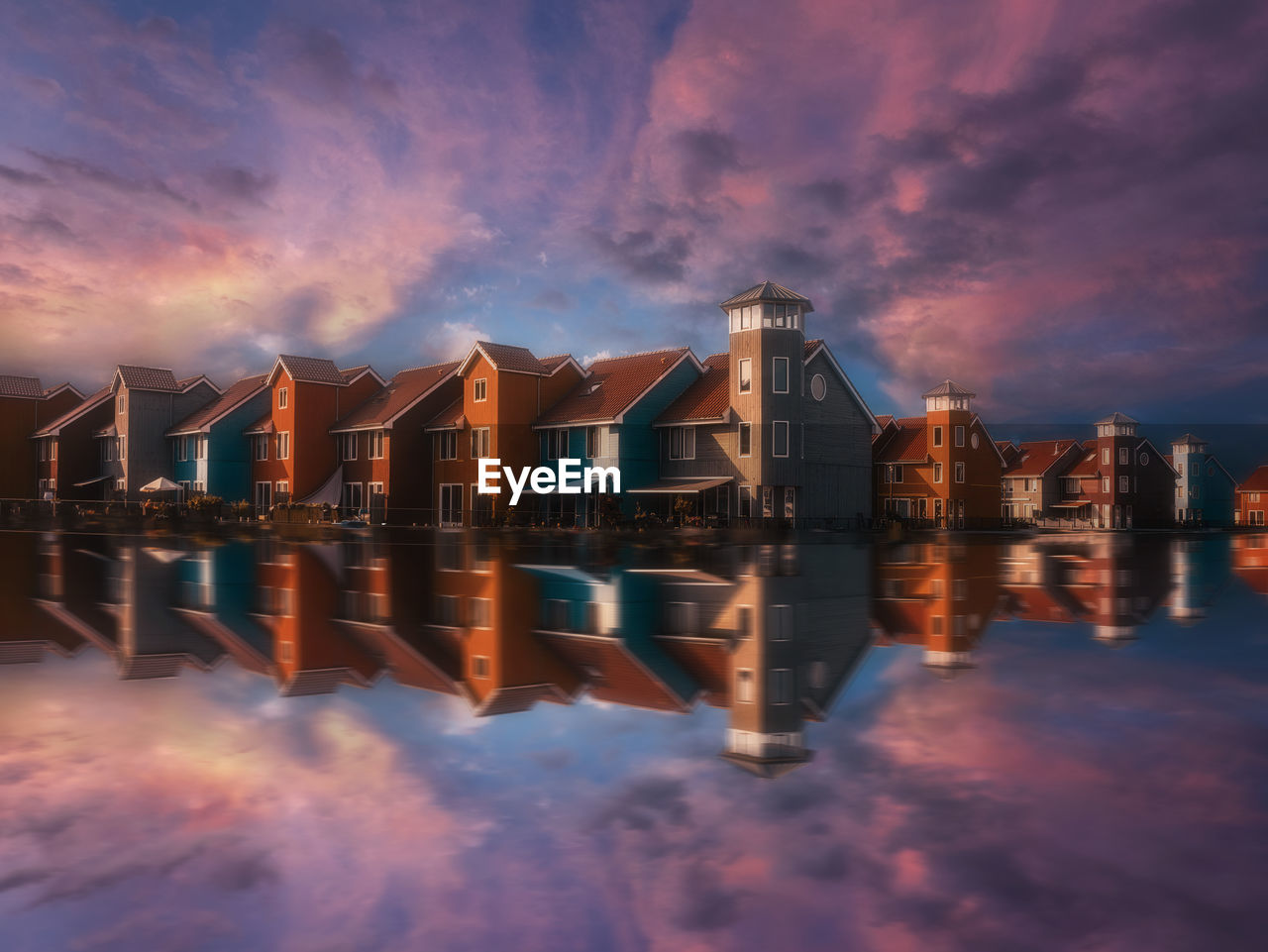 Colourful scandinavian buildings at reitdiep city marina in groningen, the netherlands.